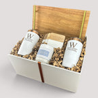 Closing Day Gifts personalized acacia wood tray gift set with engraved white tumblers, marble coasters, and candle.