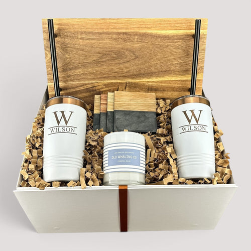 Closing Day Gifts personalized acacia wood tray set with engraved tumblers, marble coasters, and candle in a gift box.
