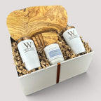 Closing Day Gifts personalized olive wood cutting board set with engraved tumblers, coasters, and candle in a gift box.