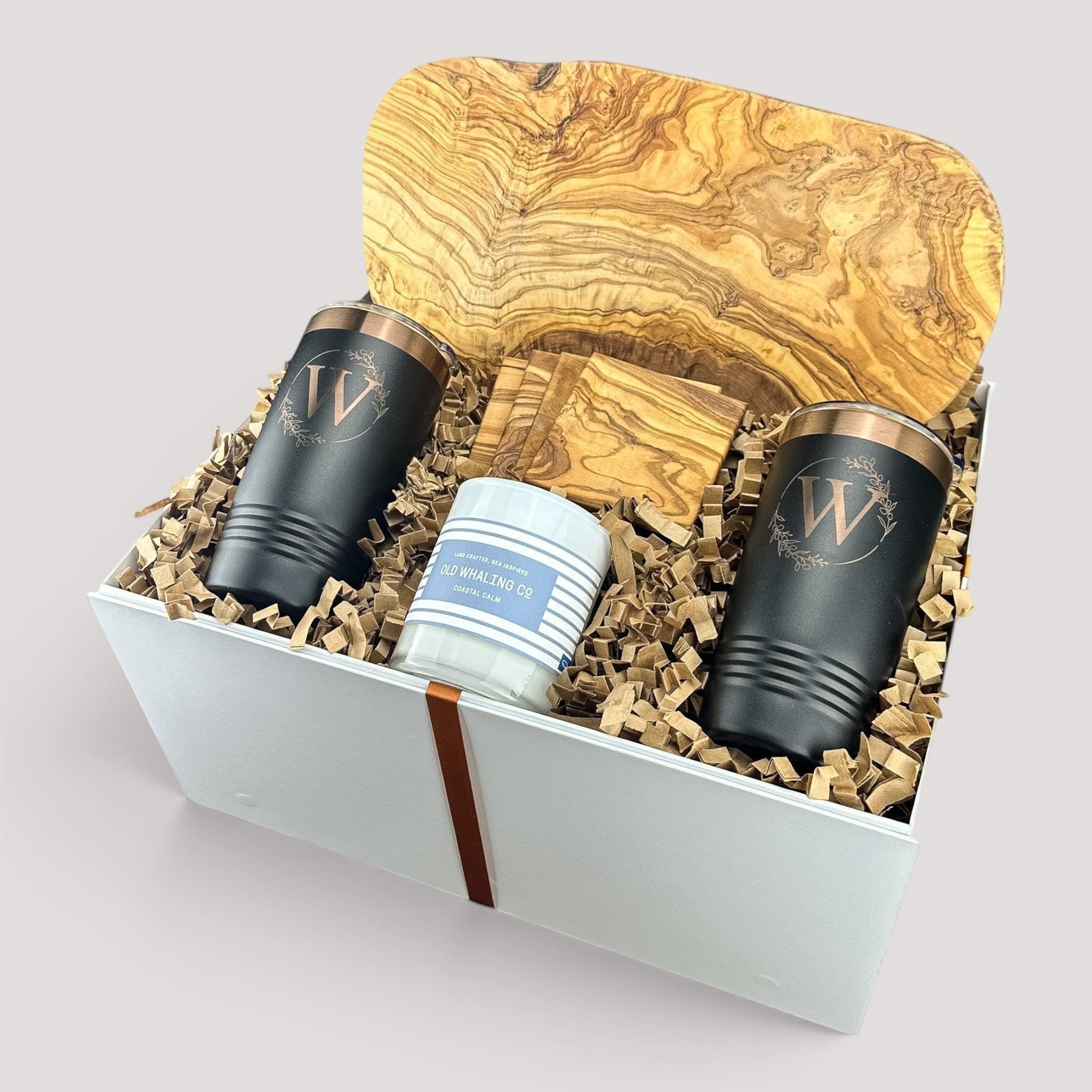 Closing Day Gifts personalized olive wood cutting board set with engraved tumblers, coasters, and a scented candle.
