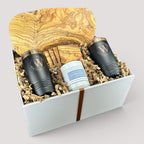 Closing Day Gifts personalized olive wood cutting board set with engraved tumblers, coasters, and a scented candle.