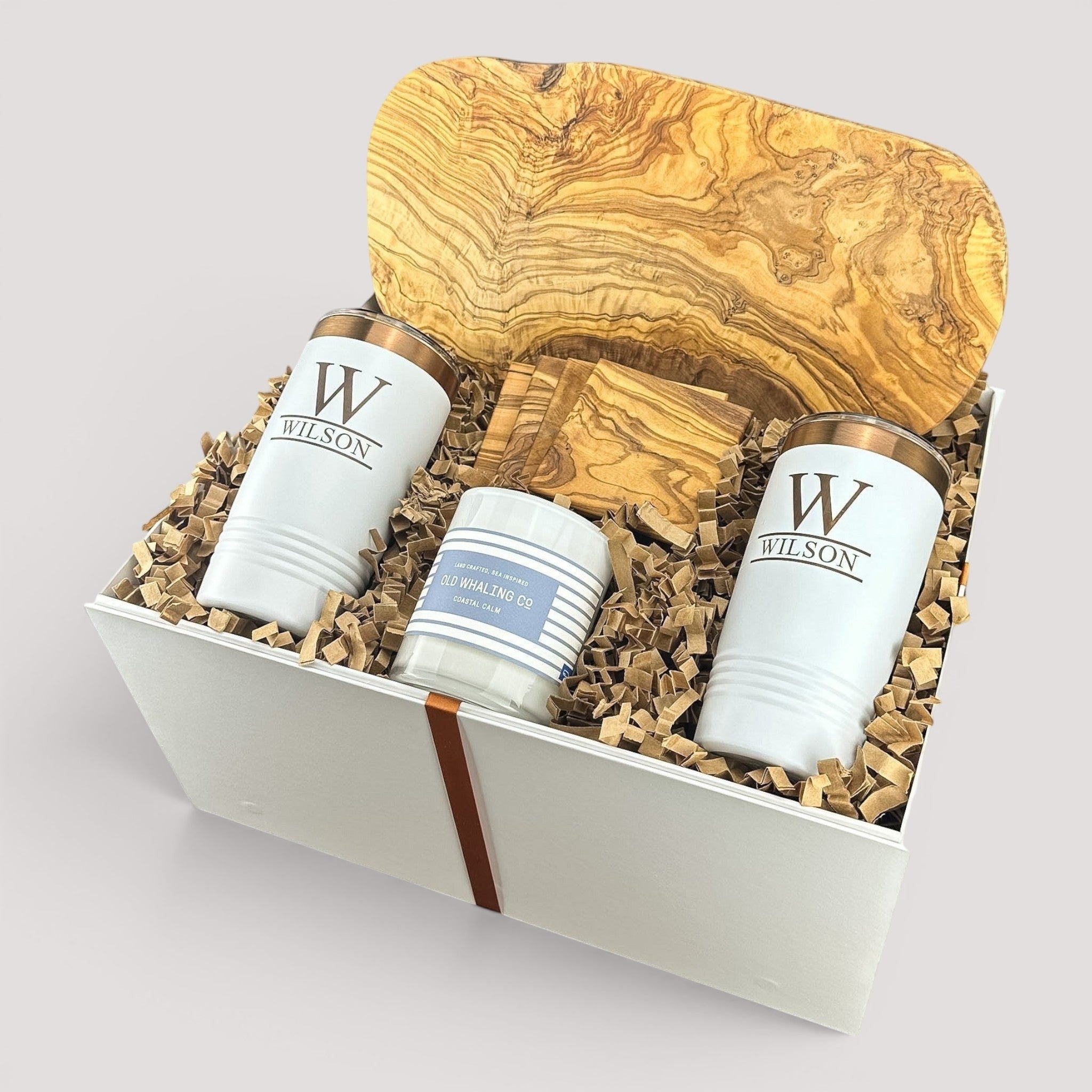 Closing Day Gifts personalized olive wood cutting board set with engraved tumblers, coasters, and candle in a gift box.