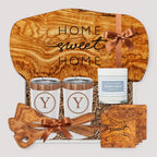 Closing Day Gifts personalized olive wood cutting board set with engraved tumblers, coasters, and Old Whaling Co candle.