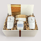Closing Day Gifts personalized closing gift set with marble and acacia board, engraved tumblers, coasters, and candle.