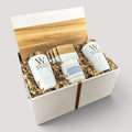 Closing Day Gifts personalized closing gift set featuring a marble and acacia board, engraved tumblers, coasters, and candle
