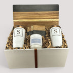 Closing Day Gifts personalized gift set with two white tumblers, marble serving board, and candle in a gift box.