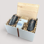 Closing Day Gifts personalized maple cutting board, black tumblers, marble coasters, and candle in a keepsake gift box.