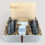 Closing Day Gifts personalized maple cutting board, black tumblers, marble coasters, and candle in a keepsake box.
