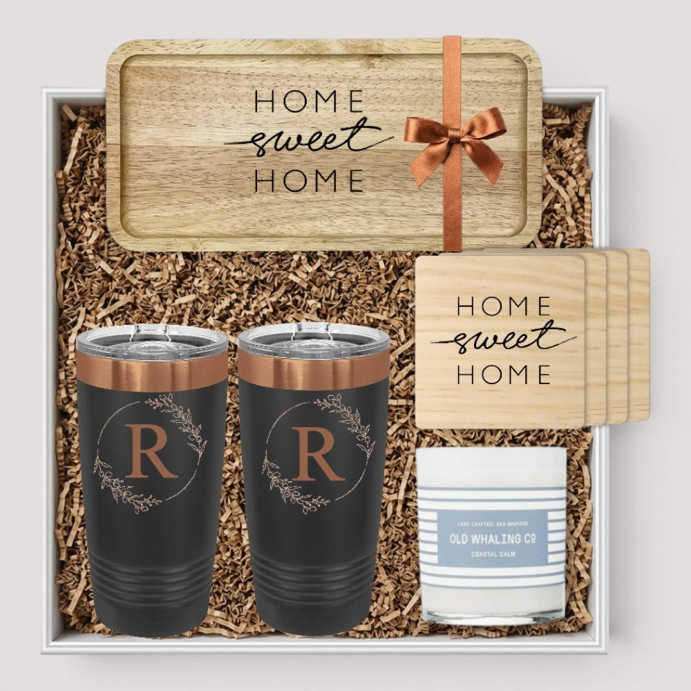 Closing Day Gifts personalized rubber wood valet tray, two black tumblers, maple coasters, and candle in a gift box.