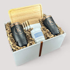 Closing Day Gifts personalized housewarming set with rubber wood tray, two black tumblers, maple coasters, and candle.