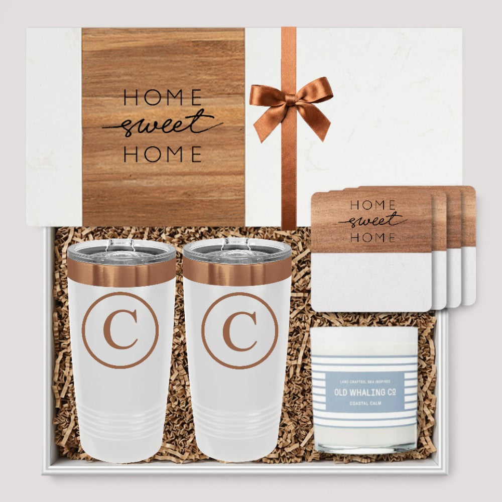 Closing Day Gifts personalized housewarming set with marble serving board, engraved tumblers, coasters, and candle.