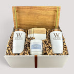 Closing Day Gifts personalized housewarming set with acacia tray, engraved white tumblers, marble coasters, and candle.
