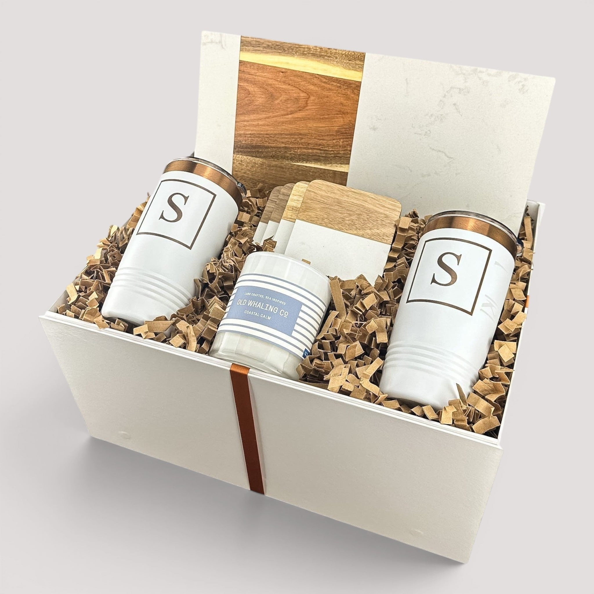 Closing Day Gifts personalized housewarming set with marble and acacia board, engraved tumblers, coasters, and candle.