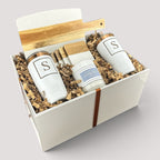Closing Day Gifts personalized housewarming set with marble serving board, engraved tumblers, coasters, and candle.