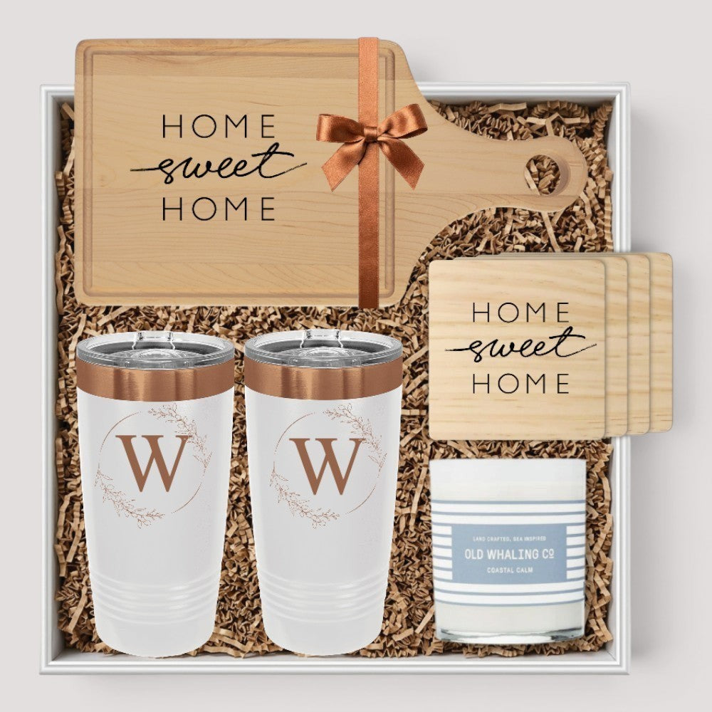 Closing Day Gifts personalized housewarming set with maple cutting board, white tumblers, coasters, and candle.