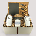 Closing Day Gifts personalized housewarming set with slate cheese board, stainless tumblers, coasters, and candle.