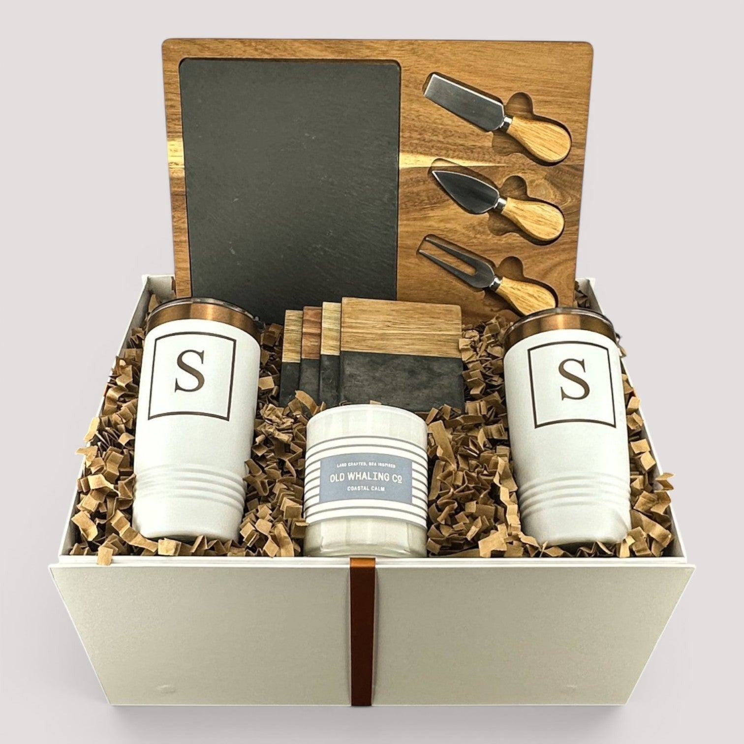 Closing Day Gifts personalized housewarming set with slate cheese board, stainless tumblers, coasters, and candle.