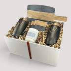 Closing Day Gifts personalized housewarming set with black marble and acacia board, tumblers, coasters, and candle.
