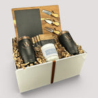 Closing Day Gifts personalized housewarming set with slate cheese board, two tumblers, coasters, and soy candle.