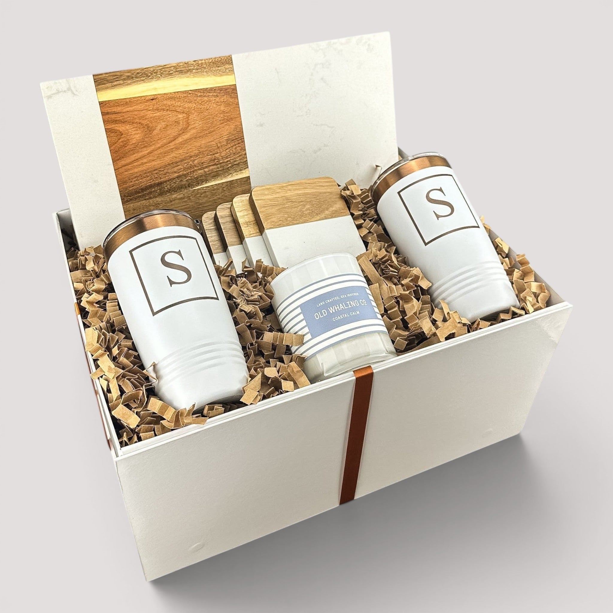 Closing Day Gifts personalized housewarming set with marble and acacia board, engraved tumblers, coasters, and candle.