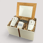 Closing Day Gifts personalized housewarming set with wood-framed print, engraved tumblers, coasters, and soy candle.