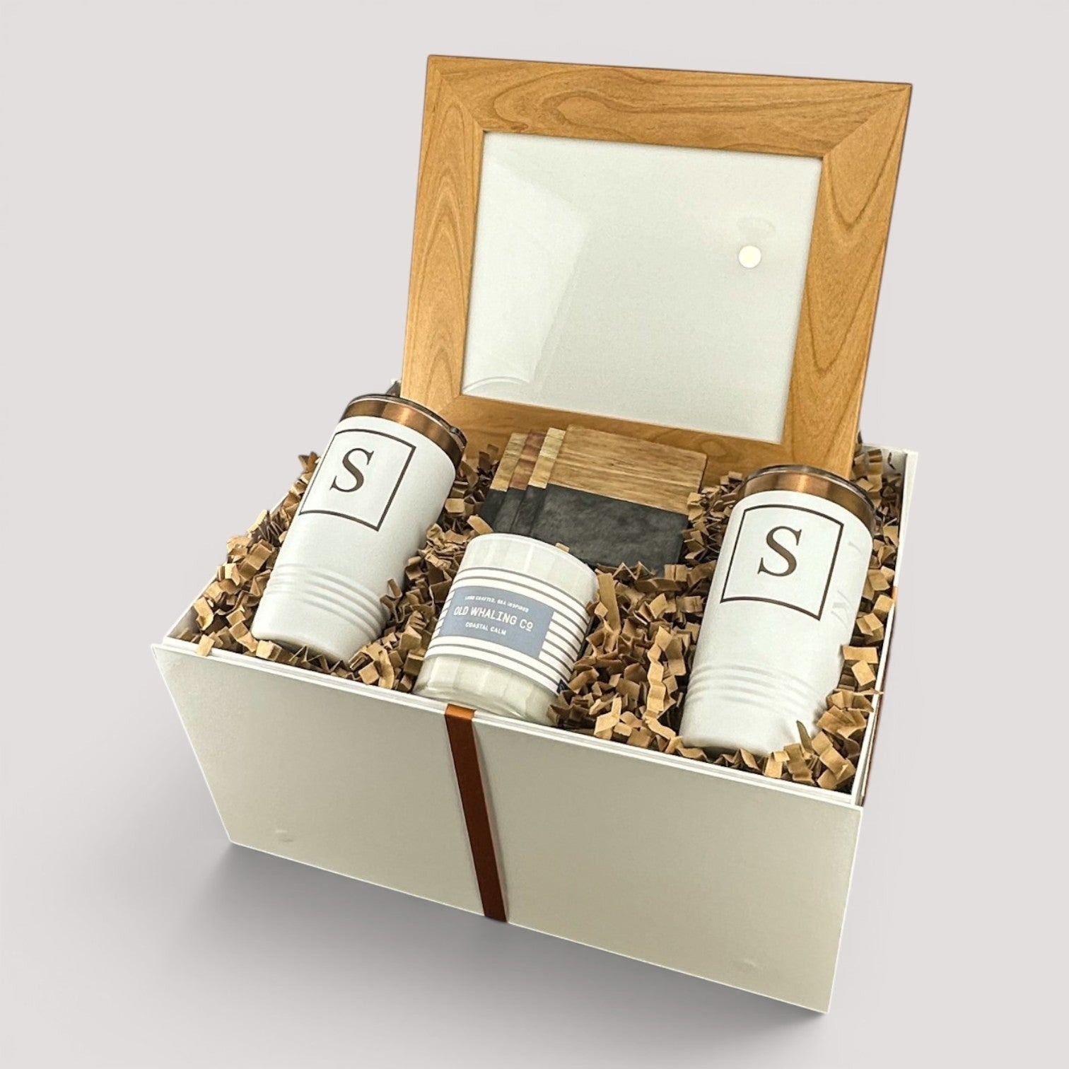 Closing Day Gifts personalized housewarming set with wood-framed print, engraved tumblers, coasters, and soy candle.