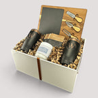Closing Day Gifts personalized housewarming set with slate cheese board, tumblers, coasters, and soy candle in a box.