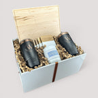 Closing Day Gifts personalized housewarming set with maple cutting board, black tumblers, marble coasters, and candle.