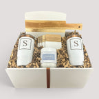 Closing Day Gifts personalized housewarming set with marble serving board, engraved tumblers, coasters, and candle.