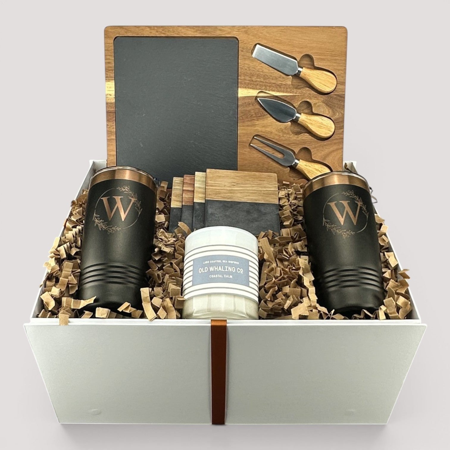Closing Day Gifts personalized housewarming set with slate cheese board, stainless tumblers, coasters, and candle.