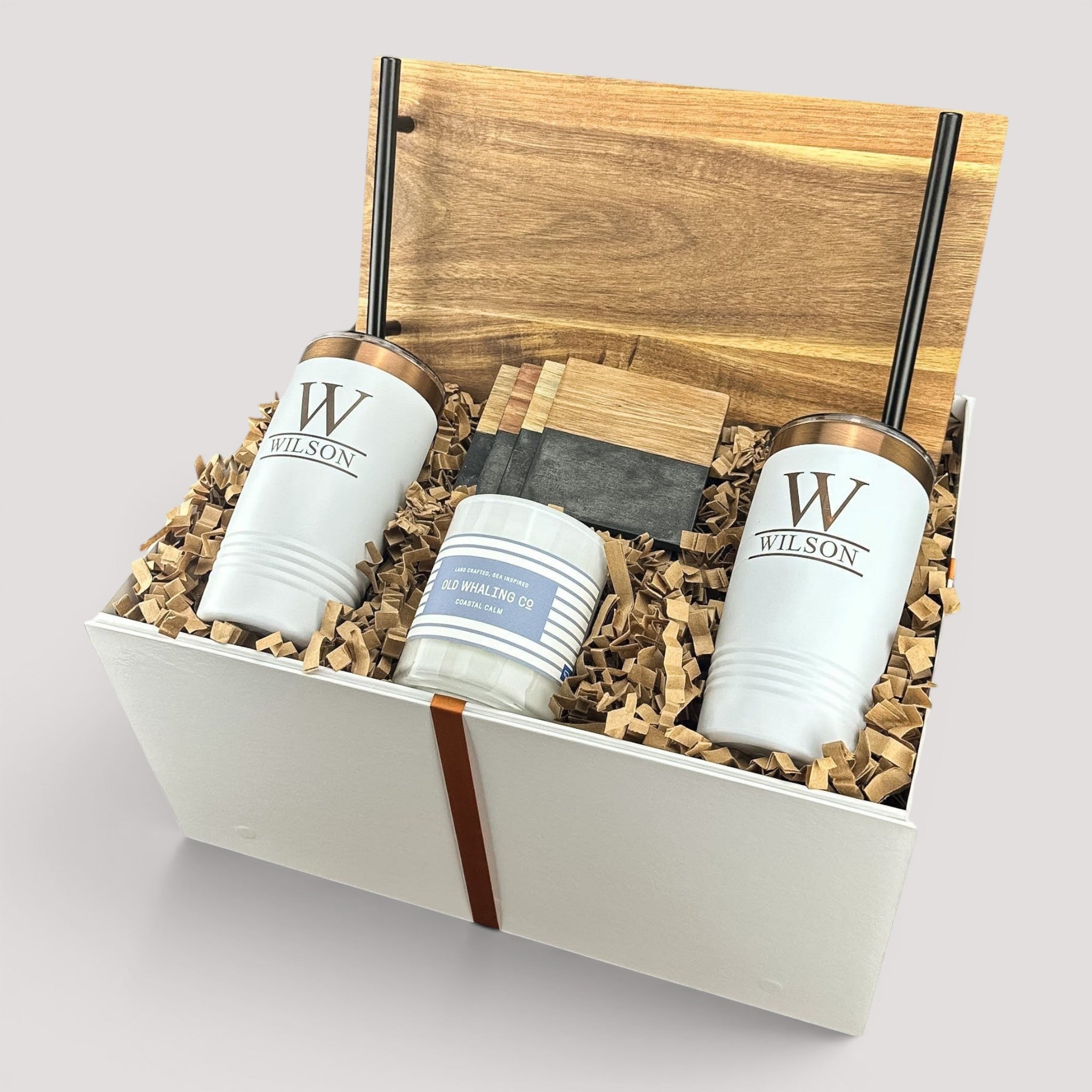 Closing Day Gifts personalized housewarming set with acacia tray, white tumblers, marble coasters, and scented candle.