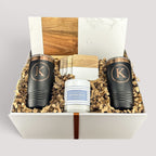 Closing Day Gifts personalized housewarming set with marble and acacia board, black tumblers, coasters, and candle.