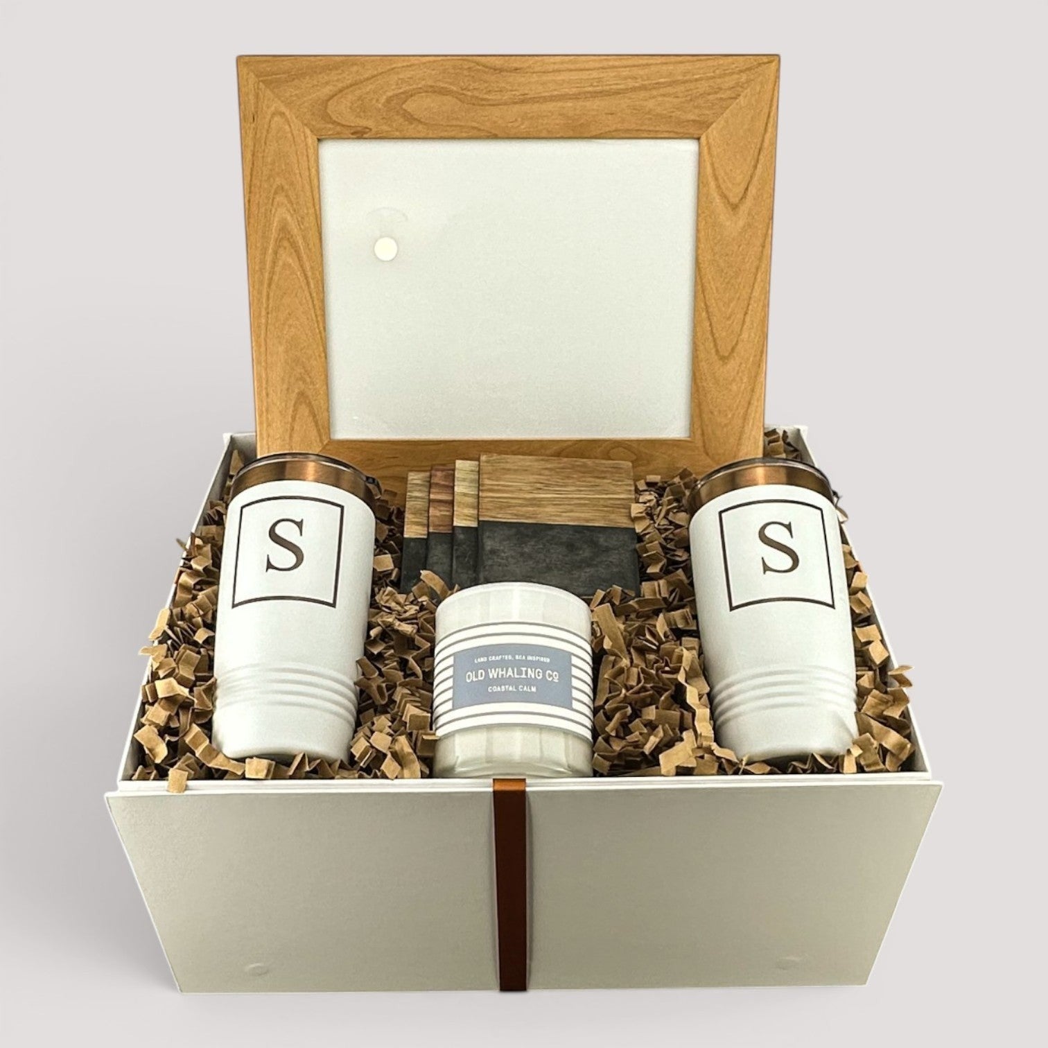 Closing Day Gifts personalized housewarming set with framed print, engraved tumblers, marble coasters, and soy candle.