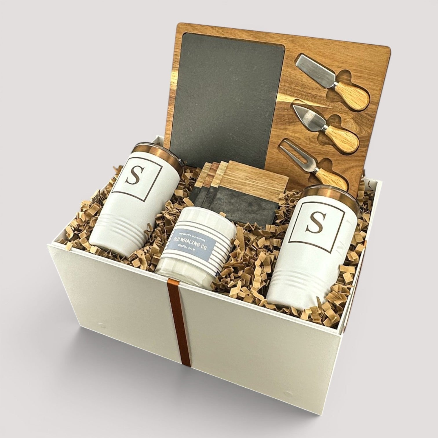 Closing Day Gifts personalized housewarming set with slate cheese board, two tumblers, coasters, and soy candle.