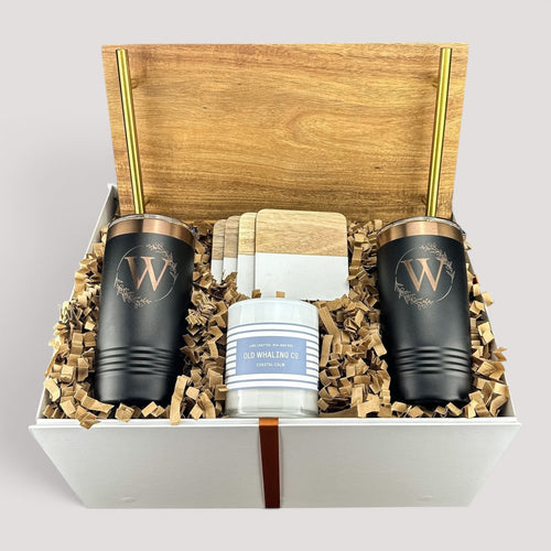 Closing Day Gifts personalized housewarming set with acacia tray, black tumblers, marble coasters, and scented candle.