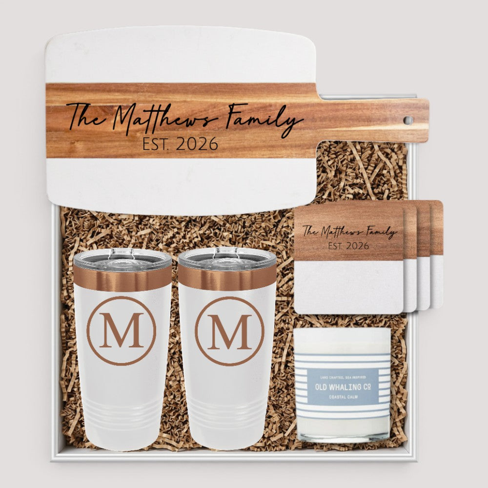 Closing Day Gifts personalized housewarming set with marble and acacia board, tumblers, coasters, and scented candle.