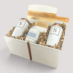 Closing Day Gifts personalized housewarming set with marble serving board, engraved tumblers, coasters, and candle.