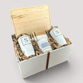 Closing Day Gifts personalized maple cutting board, engraved tumblers, marble coasters, and candle in a keepsake box.