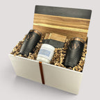 Closing Day Gifts personalized set featuring a black marble serving board, two engraved tumblers, and a scented candle.