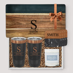 Closing Day Gifts personalized set with engraved black marble and wood serving board, two tumblers, and coasters.