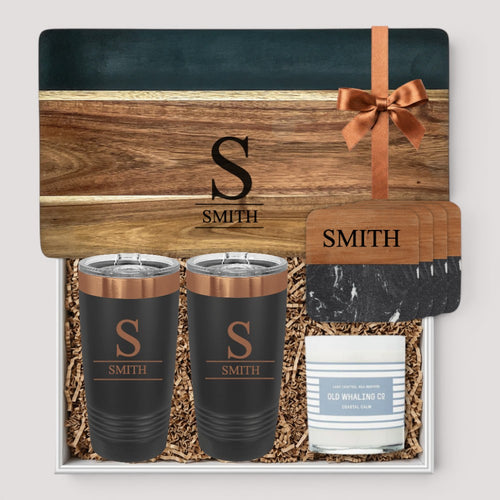 Closing Day Gifts personalized set with engraved black marble and wood serving board, two tumblers, and coasters.