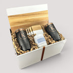 Closing Day Gifts personalized serving board set with engraved tumblers, marble coasters, and candle in a gift box.