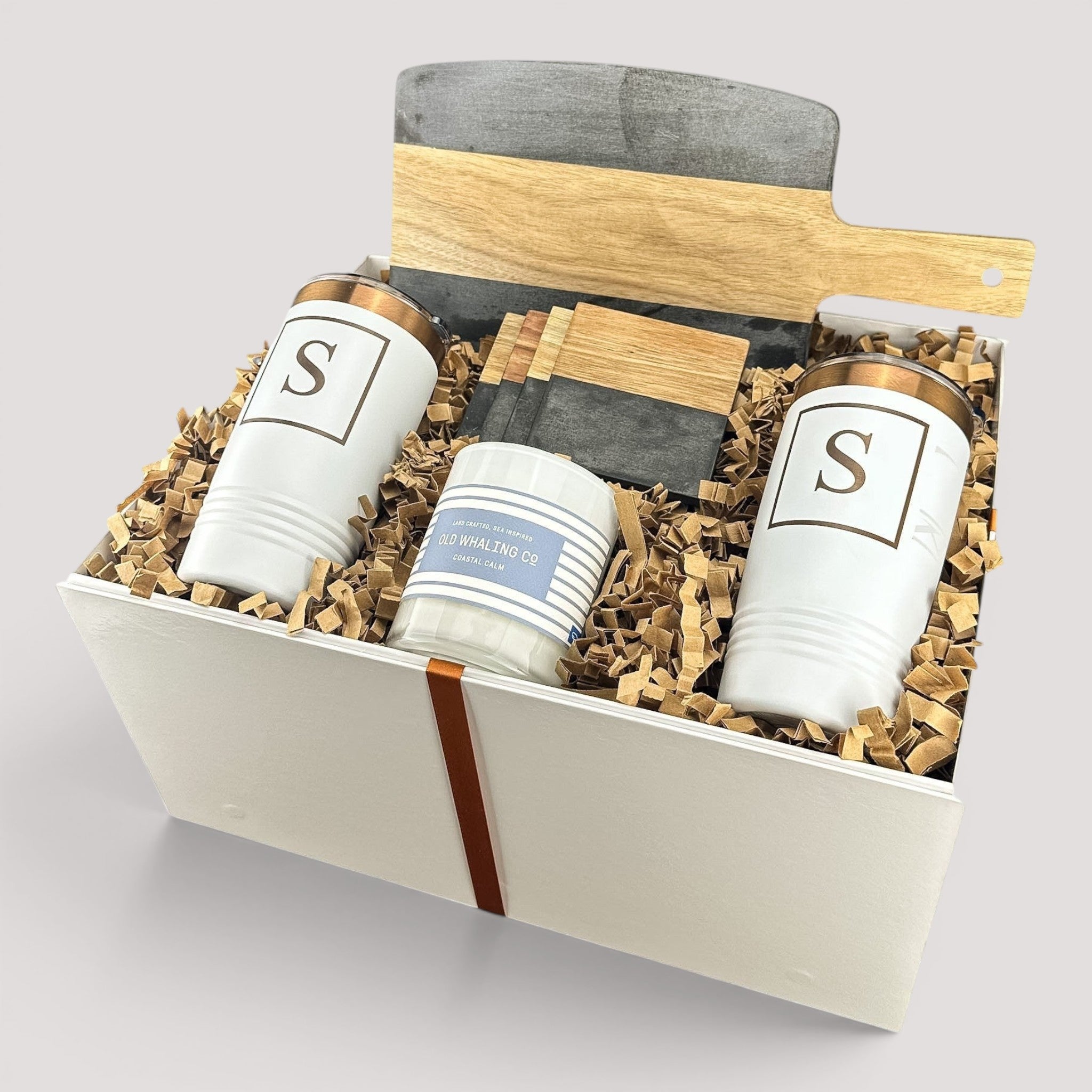 Closing Day Gifts personalized set with black marble and acacia wood board, white tumblers, coasters, and candle.