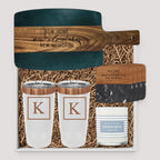 Closing Day Gifts personalized set with black marble and acacia wood board, tumblers, coasters, and scented candle.