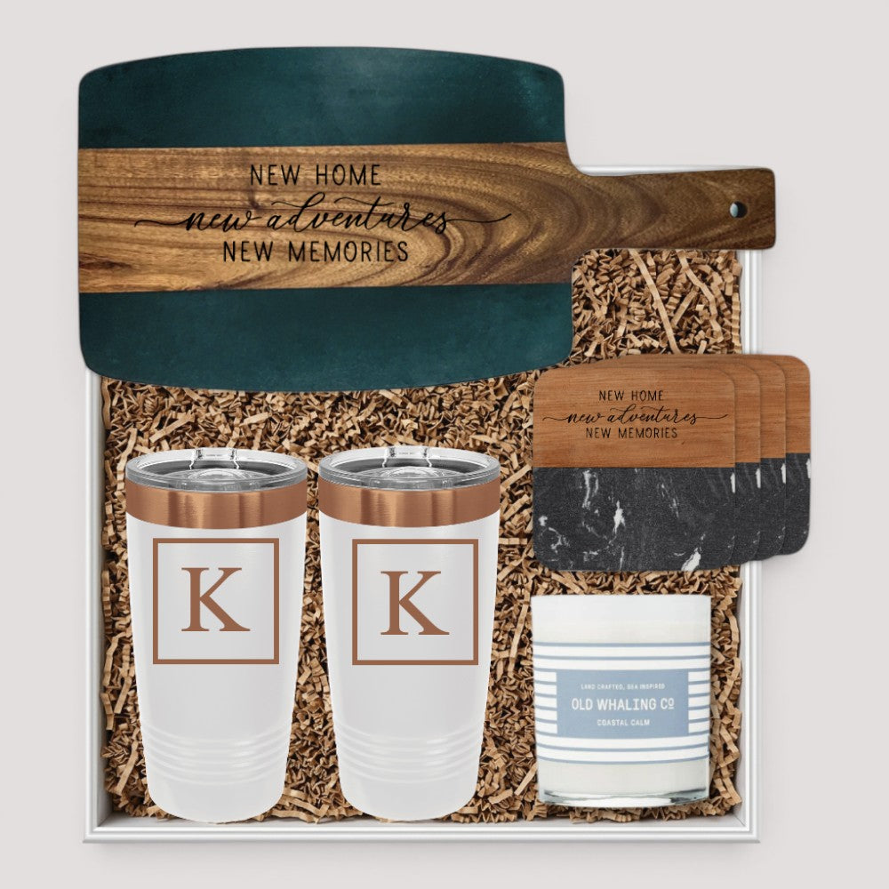 Closing Day Gifts personalized set with black marble and acacia wood board, tumblers, coasters, and scented candle.