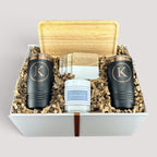 Closing Day Gifts personalized rubber wood valet tray, two black tumblers, maple coasters, and candle in a gift box.