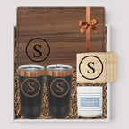 Closing Day Gifts personalized walnut cutting board, two tumblers, marble coasters, and candle in a keepsake gift box.
