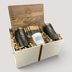 Closing Day Gifts personalized walnut cutting board set with engraved tumblers, marble coasters, and a scented candle.