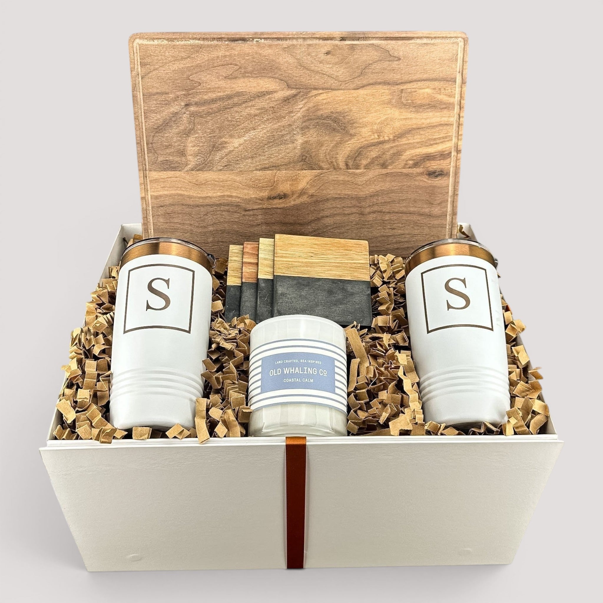 Closing Day Gifts personalized walnut cutting board set with engraved tumblers, marble coasters, and scented candle.
